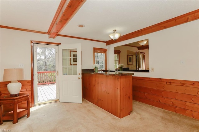 1328 Harris Rd, Virginia Beach, VA 23452 - kitchen with plenty of natural light, light colored carpet, a peninsula, beam ceiling, and crown molding