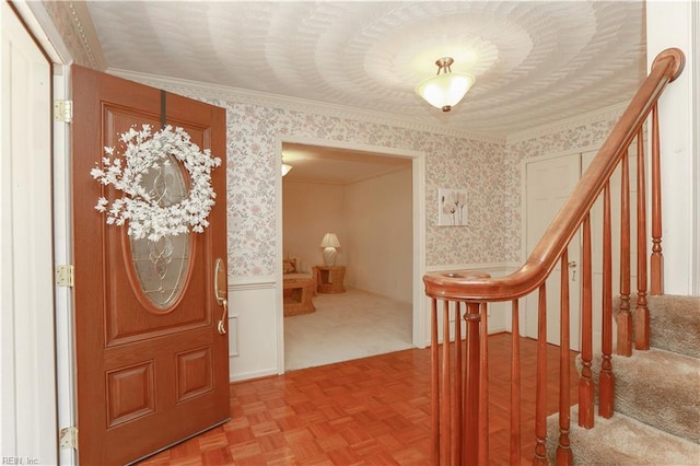 1328 Harris Rd, Virginia Beach, VA 23452 - entryway with wallpapered walls, crown molding, a wainscoted wall, and stairs