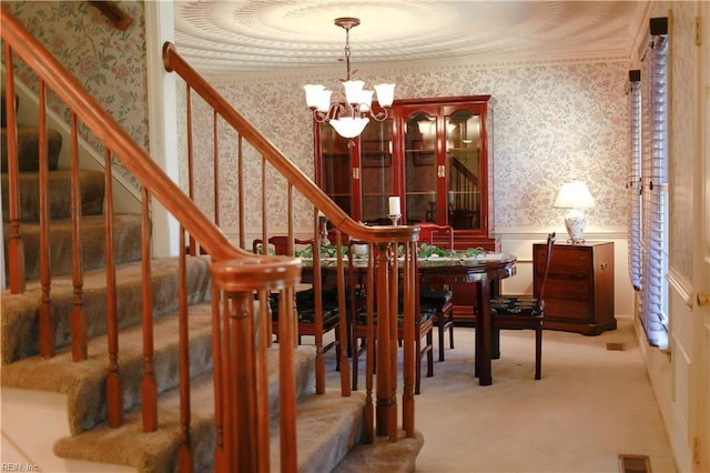 1328 Harris Rd, Virginia Beach, VA 23452 - dining space with wallpapered walls, a chandelier, a wainscoted wall, carpet flooring, and stairs