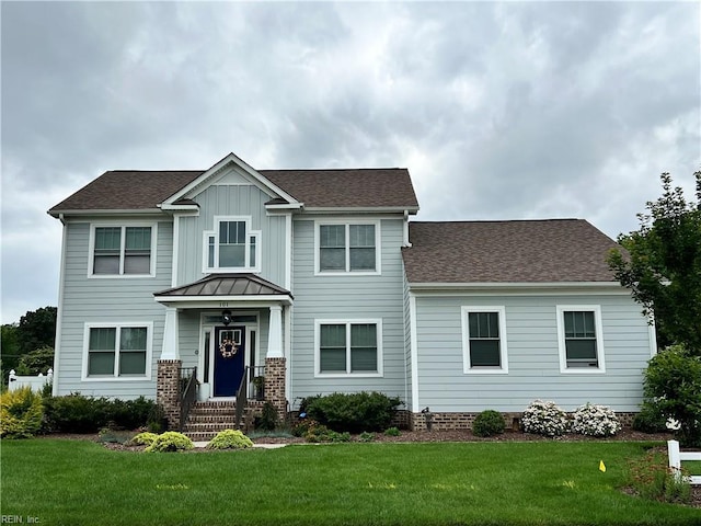101 Octavia Dr, Yorktown, VA 23693 - view of front of home with a front lawn, roof with shingles, and a standing seam roof