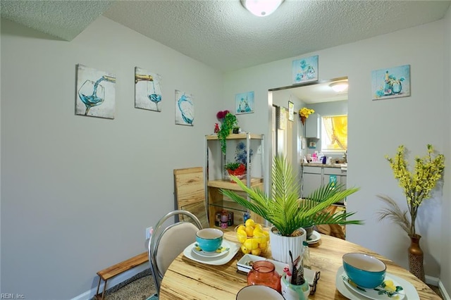 2117 King James Ct, Carrollton, VA 23314 - dining room with a textured ceiling and baseboards
