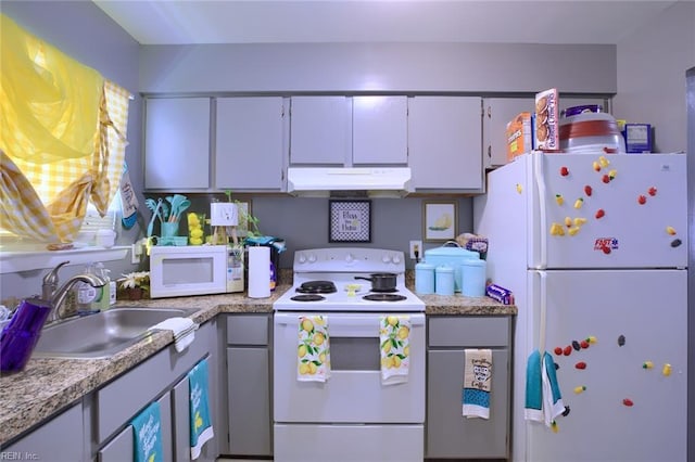 2117 King James Ct, Carrollton, VA 23314 - kitchen featuring white appliances, under cabinet range hood, a sink, light countertops, and white cabinetry