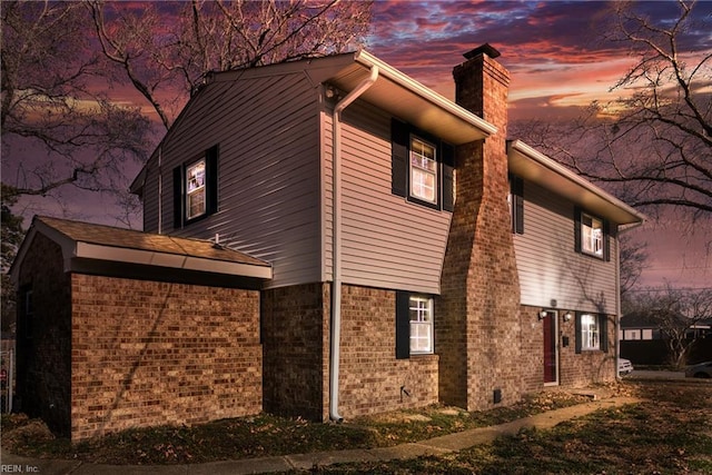 5260 Iowa Ave, Norfolk, VA 23513 - view of property exterior with a chimney and brick siding