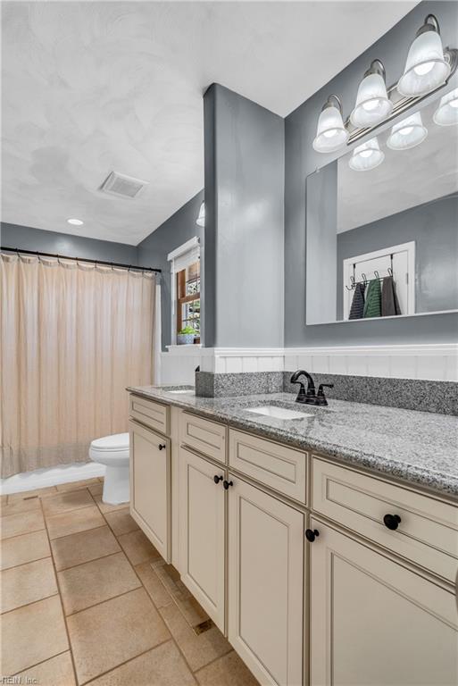 5260 Iowa Ave, Norfolk, VA 23513 - full bathroom featuring toilet, double vanity, and tile patterned floors