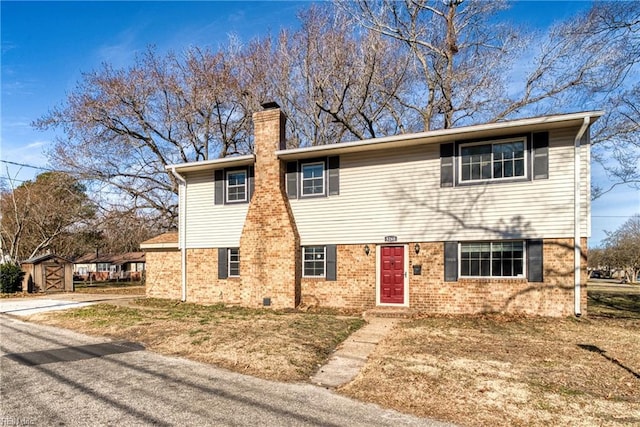 5260 Iowa Ave, Norfolk, VA 23513 - view of front of home with a chimney and brick siding