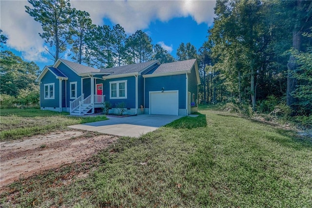 554 Trotman Rd, Camden, NC 27921 - single story home featuring concrete driveway, an attached garage, and a front lawn