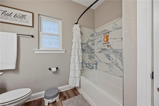 554 Trotman Rd, Camden, NC 27921 - bathroom with toilet, shower / bath combo with shower curtain, wood finished floors, and baseboards