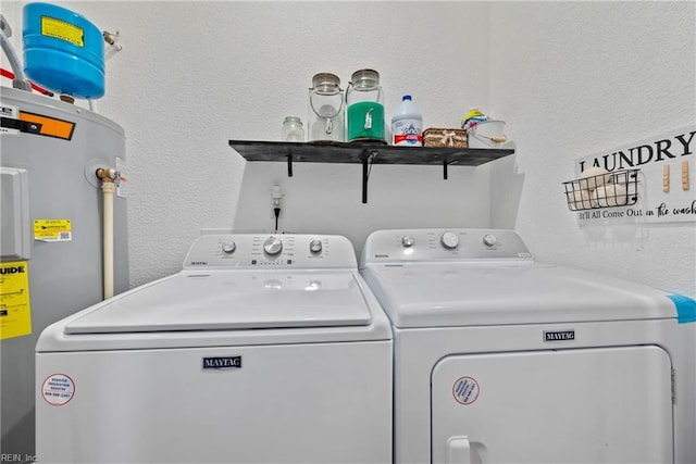 554 Trotman Rd, Camden, NC 27921 - washroom with washing machine and clothes dryer, water heater, and a textured wall