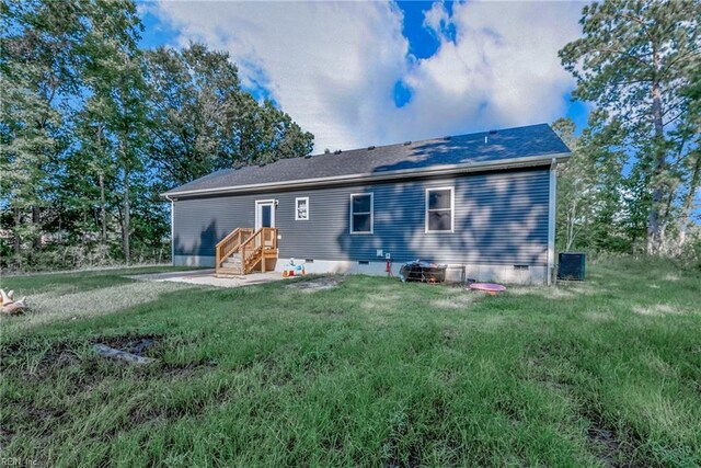 554 Trotman Rd, Camden, NC 27921 - rear view of property featuring crawl space, a yard, and central air condition unit