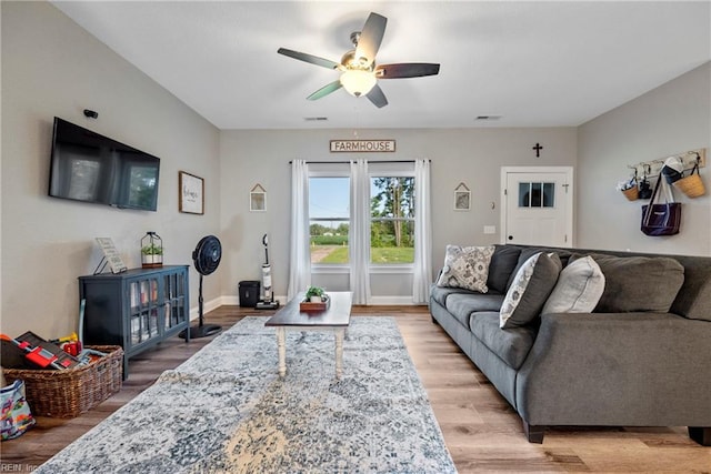 554 Trotman Rd, Camden, NC 27921 - living area with a ceiling fan, light wood-style flooring, and baseboards