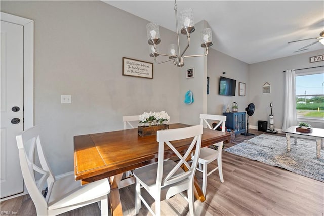 554 Trotman Rd, Camden, NC 27921 - dining area featuring a chandelier, wood finished floors, and baseboards