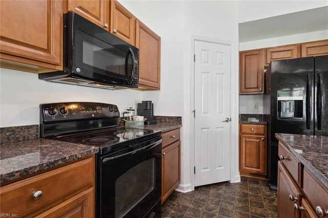648 Sea Turtle Way, Newport News, VA 23601 - kitchen with black appliances, brown cabinetry, and dark stone counters