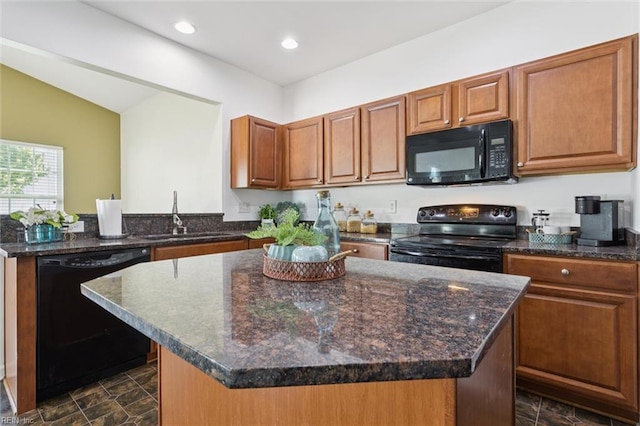 648 Sea Turtle Way, Newport News, VA 23601 - kitchen with black appliances, brown cabinets, stone finish flooring, a peninsula, and dark stone countertops