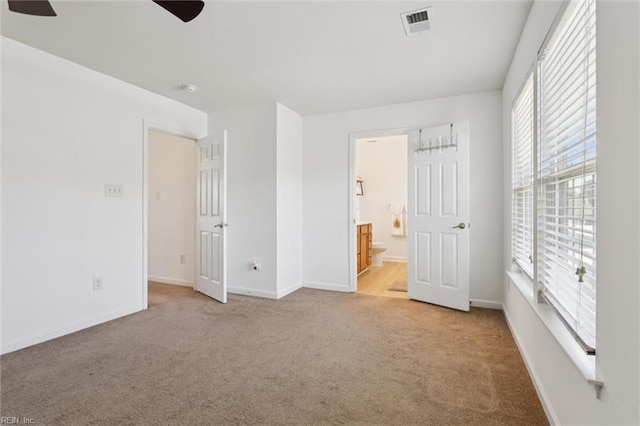 648 Sea Turtle Way, Newport News, VA 23601 - unfurnished bedroom with multiple windows, carpet floors, and ensuite bath