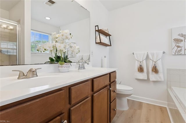 648 Sea Turtle Way, Newport News, VA 23601 - full bathroom with wood finished floors, a garden tub, double vanity, and a tile shower