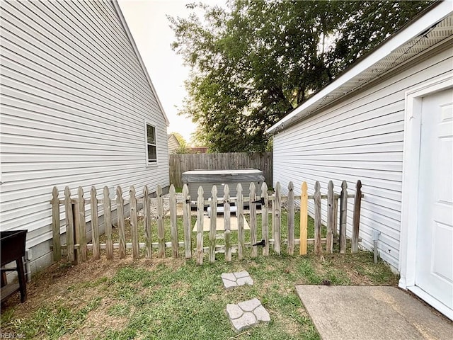 1135 Virginia Ave, Chesapeake, VA 23324 - fenced backyard with a hot tub
