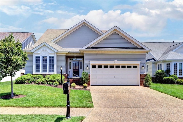 6716 Tarpleys Tavern Rd, Williamsburg, VA 23188 - view of front of home with driveway, an attached garage, a front yard, and brick siding