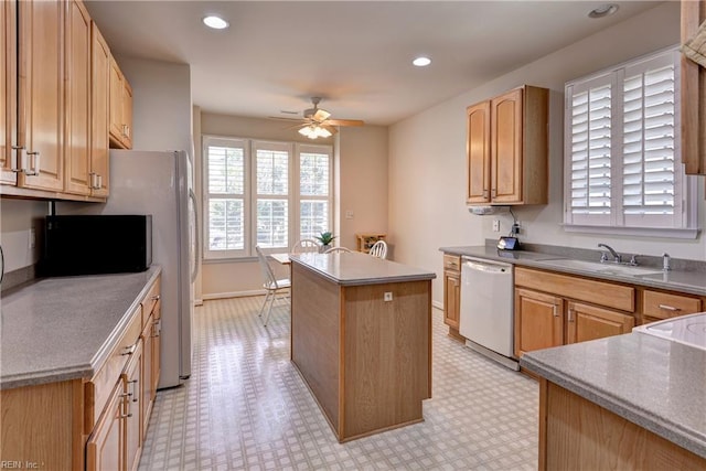 6716 Tarpleys Tavern Rd, Williamsburg, VA 23188 - kitchen featuring white dishwasher, a kitchen island, a ceiling fan, light flooring, and recessed lighting