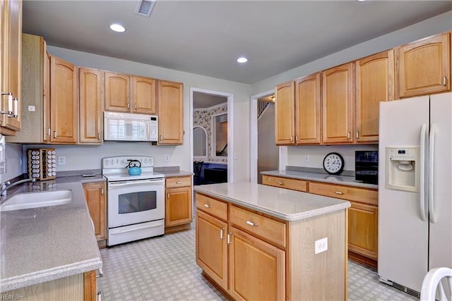 6716 Tarpleys Tavern Rd, Williamsburg, VA 23188 - kitchen featuring white appliances, light floors, a kitchen island, light countertops, and recessed lighting