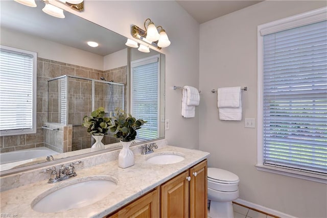 6716 Tarpleys Tavern Rd, Williamsburg, VA 23188 - bathroom featuring a stall shower, double vanity, healthy amount of natural light, and tile patterned flooring