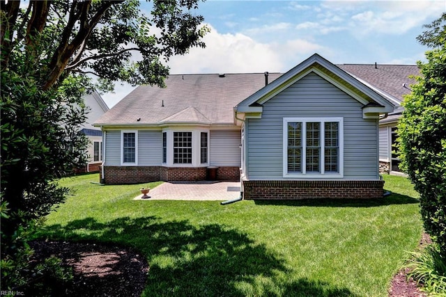 6716 Tarpleys Tavern Rd, Williamsburg, VA 23188 - rear view of property with a patio, a lawn, and brick siding