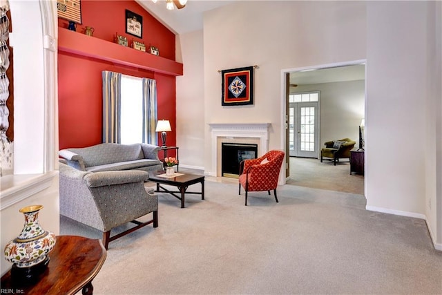 6716 Tarpleys Tavern Rd, Williamsburg, VA 23188 - carpeted living area with high vaulted ceiling and a fireplace with flush hearth