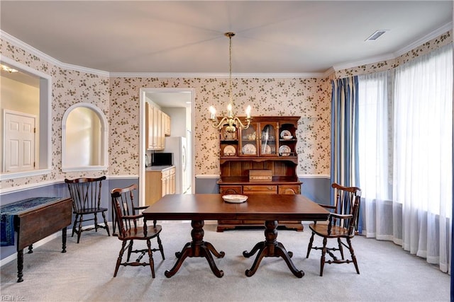 6716 Tarpleys Tavern Rd, Williamsburg, VA 23188 - dining space with wallpapered walls, a wainscoted wall, crown molding, a chandelier, and light colored carpet