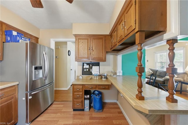 1348 Carlton Ct, Norfolk, VA 23503 - kitchen featuring stainless steel refrigerator with ice dispenser, a ceiling fan, light wood finished floors, light countertops, and brown cabinets