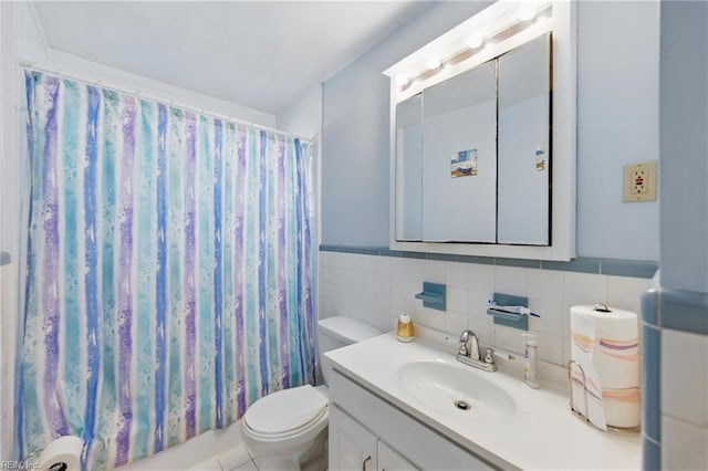 1348 Carlton Ct, Norfolk, VA 23503 - bathroom with toilet, vanity, tile walls, a shower with shower curtain, and a wainscoted wall