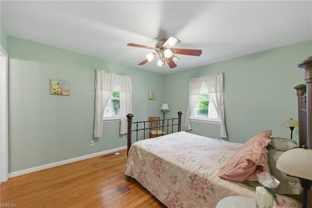 1348 Carlton Ct, Norfolk, VA 23503 - bedroom featuring multiple windows, wood finished floors, baseboards, and a ceiling fan
