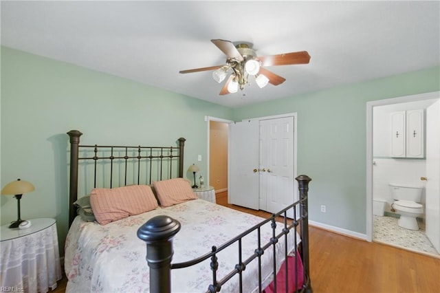 1348 Carlton Ct, Norfolk, VA 23503 - bedroom featuring wood finished floors, a closet, connected bathroom, baseboards, and a ceiling fan