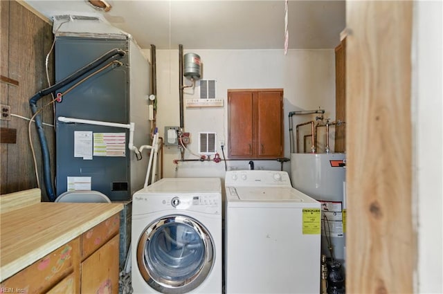 1348 Carlton Ct, Norfolk, VA 23503 - laundry area with cabinet space, washing machine and dryer, and water heater