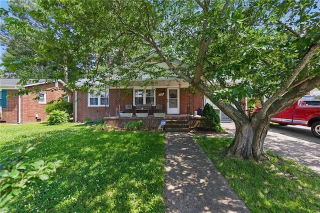 1348 Carlton Ct, Norfolk, VA 23503 - view of front of home with covered porch, a front lawn, and brick siding