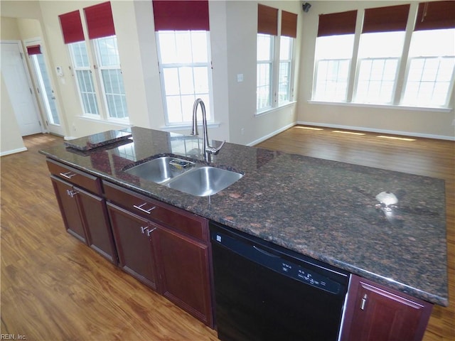 521 Simpson Ln, Chesapeake, VA 23323 - kitchen featuring dishwasher, a sink, wood finished floors, open floor plan, and a center island with sink