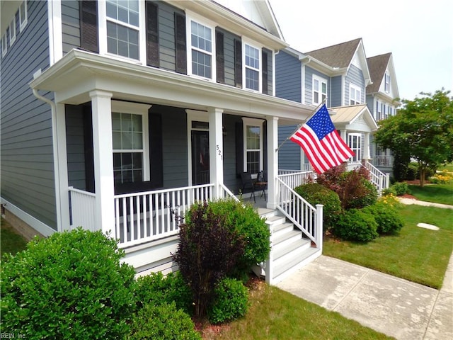 521 Simpson Ln, Chesapeake, VA 23323 - view of front of property with a porch and a front yard