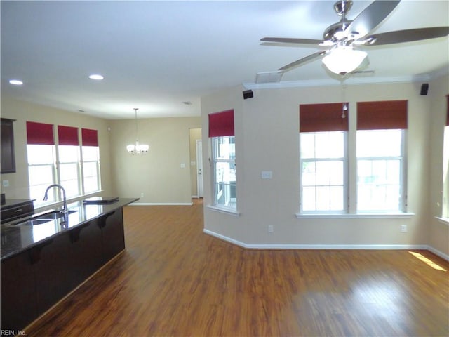 521 Simpson Ln, Chesapeake, VA 23323 - kitchen with a sink, baseboards, dark wood-style flooring, a chandelier, and recessed lighting