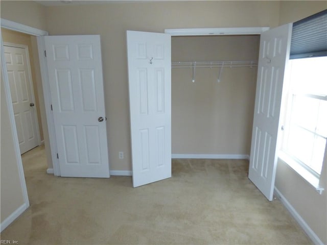521 Simpson Ln, Chesapeake, VA 23323 - unfurnished bedroom with light carpet, a closet, and baseboards
