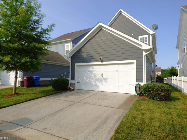 521 Simpson Ln, Chesapeake, VA 23323 - view of front facade with an attached garage and driveway