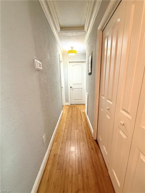 138 Ransone St, Hampton, VA 23669 - hall featuring a textured wall, ornamental molding, light wood finished floors, and attic access