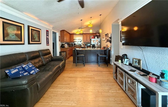 138 Ransone St, Hampton, VA 23669 - living area featuring light wood-style floors, ceiling fan, a textured ceiling, vaulted ceiling, and ornamental molding