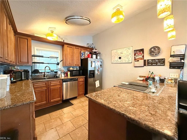 138 Ransone St, Hampton, VA 23669 - kitchen with stainless steel appliances, brown cabinets, a textured ceiling, light tile patterned floors, and dark stone counters
