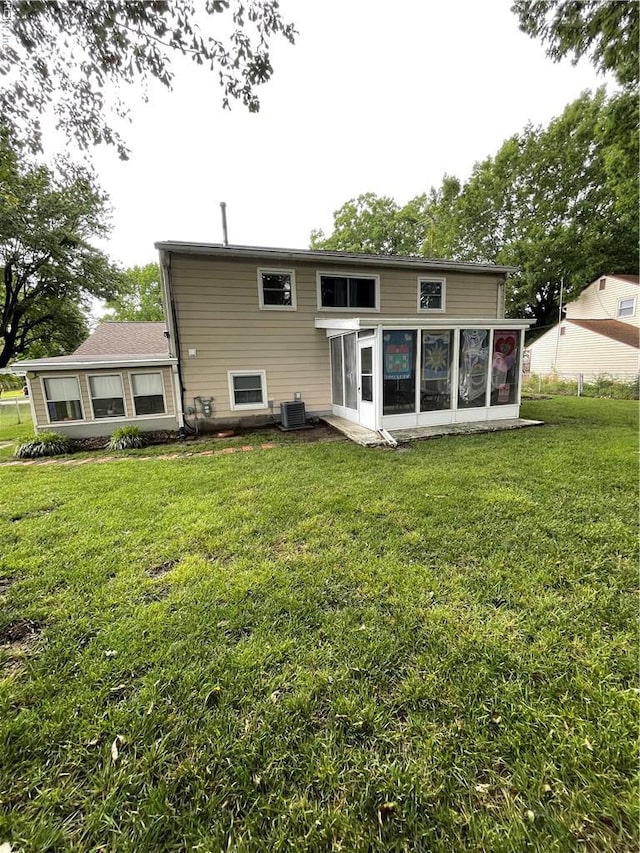 5972 Lockamy Ln, Norfolk, VA 23502 - back of house with a sunroom, central AC unit, and a yard