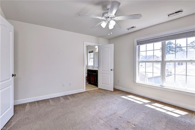 225 Quarterpath Rd, Williamsburg, VA 23185 - unfurnished bedroom with light colored carpet, baseboards, and multiple windows