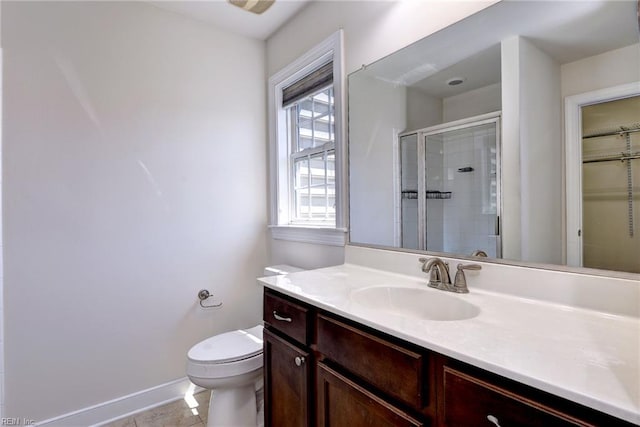 225 Quarterpath Rd, Williamsburg, VA 23185 - full bath featuring vanity, a stall shower, toilet, baseboards, and a spacious closet
