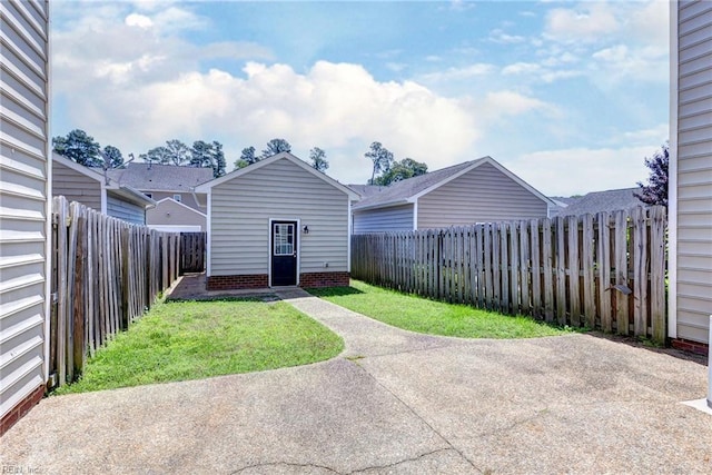 225 Quarterpath Rd, Williamsburg, VA 23185 - view of yard with a patio area and an outbuilding