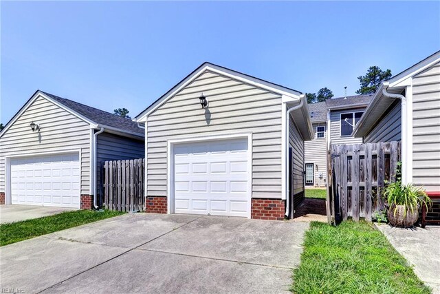225 Quarterpath Rd, Williamsburg, VA 23185 - view of front of home with a garage and an outbuilding