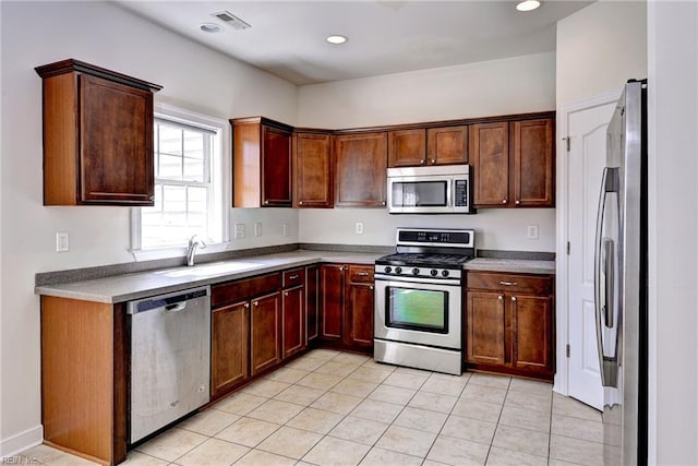 225 Quarterpath Rd, Williamsburg, VA 23185 - kitchen featuring stainless steel appliances, a sink, light tile patterned flooring, and recessed lighting