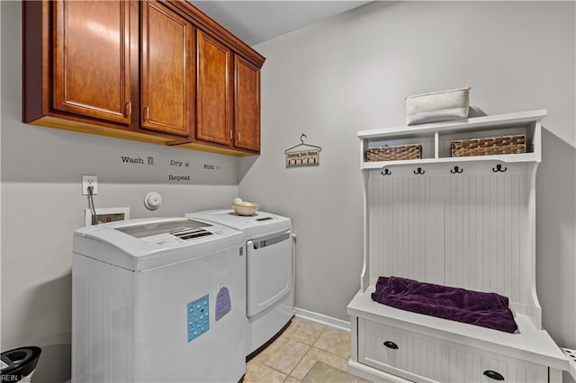 122 Merchant Man Ct, Williamsburg, VA 23185 - washroom featuring separate washer and dryer, cabinet space, baseboards, and light tile patterned floors