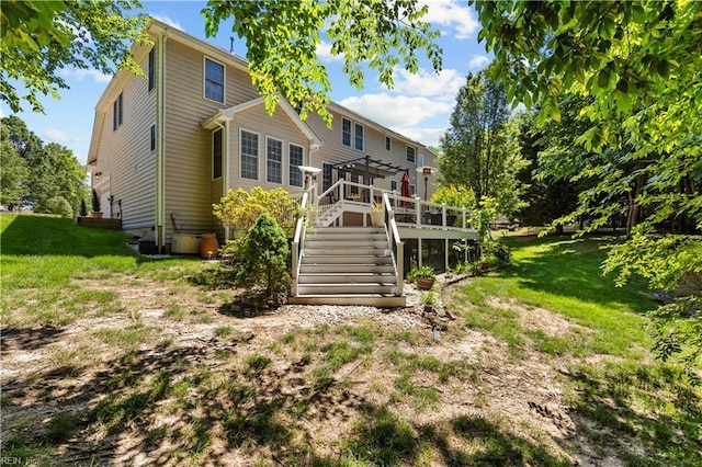 122 Merchant Man Ct, Williamsburg, VA 23185 - rear view of house featuring stairway, a deck, and a lawn