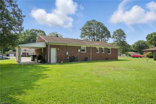 816 Colony Manor Rd, Chesapeake, VA 23321 - rear view of property with cooling unit, a yard, a carport, and brick siding